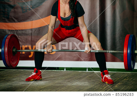 female athlete exercise deadlift in powerlifting competition female athlete exercise deadlift in powerlifting competition 85196283