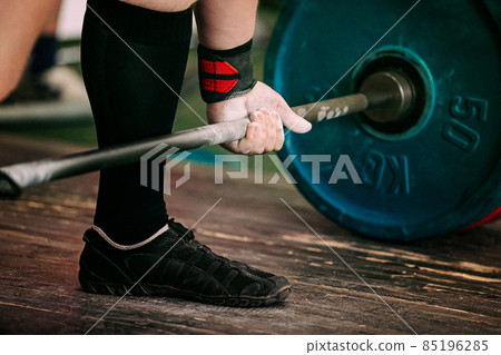 close-up athlete and barbell exercise deadlift close-up athlete and barbell exercise deadlift 85196285