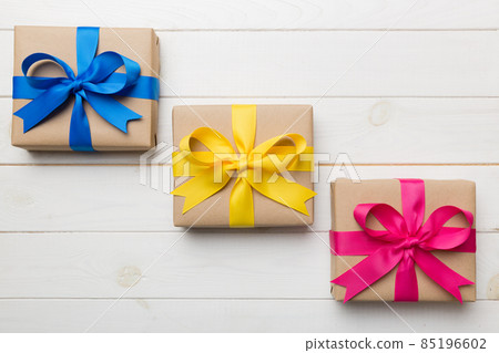Collection of Holiday present boxes on a colored background. top view close up 85196602