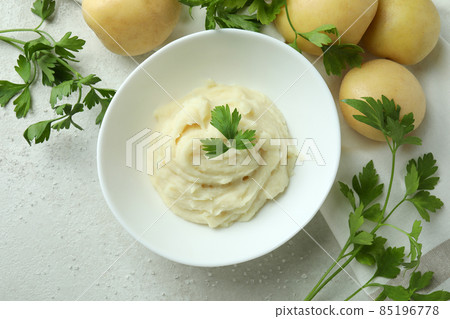 Concept of tasty eating with mashed potatoes on white textured table 85196778