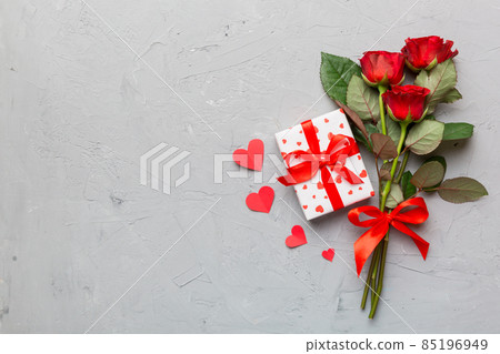 Valentine's day composition with rose flower, red heart and gift boxes on table. mother day and birthday greeting, copy space, top view Valentine's day composition with rose flower, red heart and gift boxes on table. mother day and birthday greeting, copy space, top view 85196949