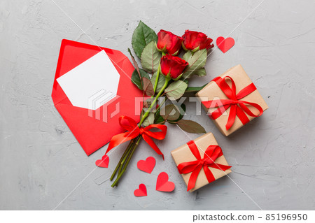 Valentine day composition with Envelope, rose flower and Red heart on table. Top view, flat lay. Holiday concept Valentine day composition with Envelope, rose flower and Red heart on table. Top view, flat lay. Holiday concept 85196950