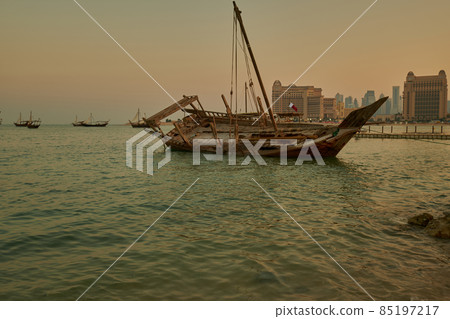 Katara eleventh traditional dhow festival in Doha Qatar sunset shot showing  dhows with Qatar Flag in Arabic gulf 85197217