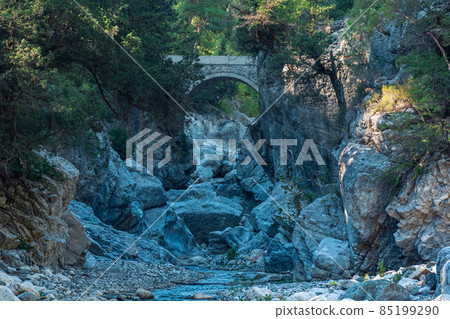 ancient Roman bridge over a shady gorge in the Kesme Bogazi canyon, Turkey ancient Roman bridge over a shady gorge in the Kesme Bogazi canyon, Turkey 85199290
