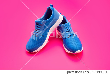 sporty blue sneakers pair on pink background, sneakers 85199381
