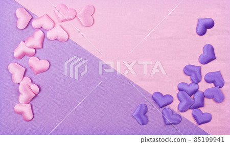 Pink and purple satin hearts in a cornars on paper texture for Valentine Day Pink and purple satin hearts in a cornars on paper texture for Valentine Day 85199941