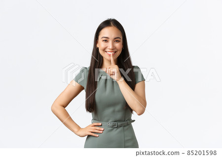 Small business owners, women entrepreneurs concept. Cheerful pretty asian woman having secret, prepare surprise asking keep quiet, show shhh, hush gesture and smiling, white background Small business owners, women entrepreneurs concept. Cheerful pretty asian woman having secret, prepare surprise asking keep quiet, show shhh, hush gesture and smiling, white background 85201598