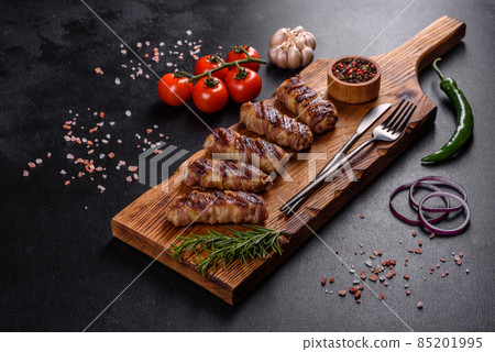 A delicious dish of pork mince wrapped with delicious pieces of bacon A delicious dish of pork mince wrapped with delicious pieces of bacon 85201995