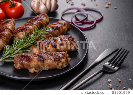 A delicious dish of pork mince wrapped with delicious pieces of bacon A delicious dish of pork mince wrapped with delicious pieces of bacon 85201999