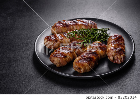 A delicious dish of pork mince wrapped with delicious pieces of bacon A delicious dish of pork mince wrapped with delicious pieces of bacon 85202014