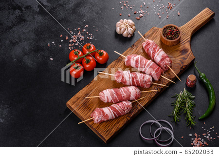 A delicious dish of pork mince wrapped with delicious pieces of bacon A delicious dish of pork mince wrapped with delicious pieces of bacon 85202033