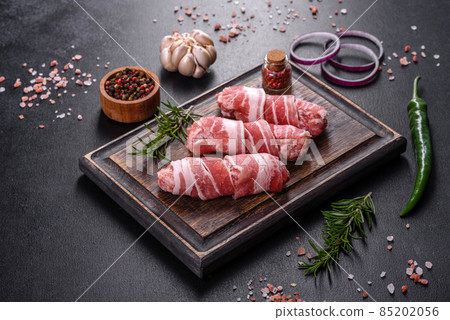 A delicious dish of pork mince wrapped with delicious pieces of bacon A delicious dish of pork mince wrapped with delicious pieces of bacon 85202056