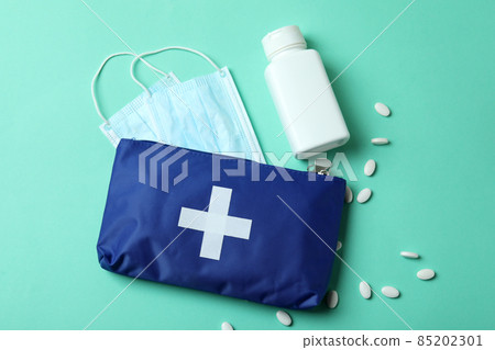 First aid medical kit on mint background First aid medical kit on mint background 85202301