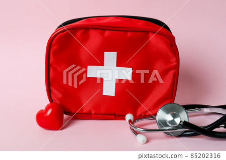 First aid medical kit on pink background First aid medical kit on pink background 85202316