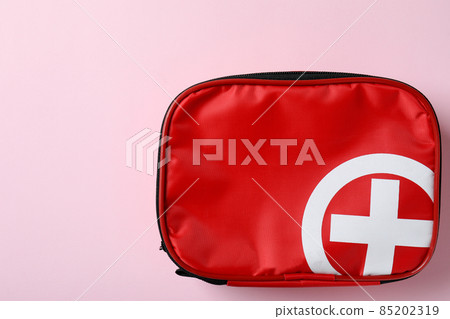 First aid medical kit on pink background First aid medical kit on pink background 85202319