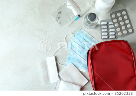 First aid medical kit on white textured table 85202338