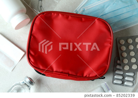 First aid medical kit on white textured table First aid medical kit on white textured table 85202339