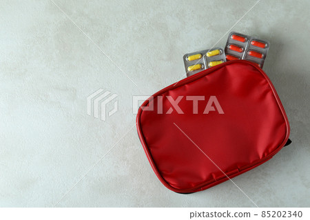 First aid medical kit on white textured table First aid medical kit on white textured table 85202340