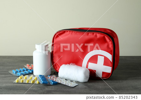 First aid medical kit on gray textured table First aid medical kit on gray textured table 85202343