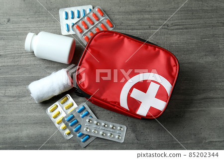 First aid medical kit on gray textured table First aid medical kit on gray textured table 85202344