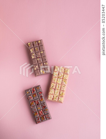 Set of chokolate bars on pink background 85203447