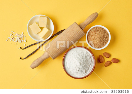 baking ingredients on yellow background 85203916