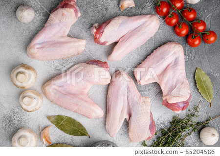 Raw turkey wings, on gray stone table background, top view flat lay Raw turkey wings, on gray stone table background, top view flat lay 85204586
