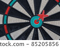 Darts gameboard and arrow in bulls eye 85205856