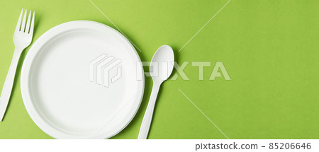 Eco friendly biodegradable paper disposable for packaging food and paper glass on green background. 85206646
