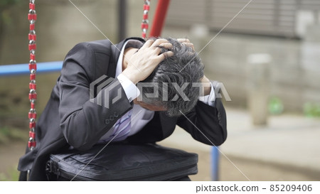 A lonely park where businessmen are worried A lonely park where businessmen are worried 85209406