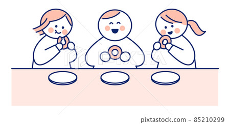 A child eating a donut for a snack with a smile 85210299