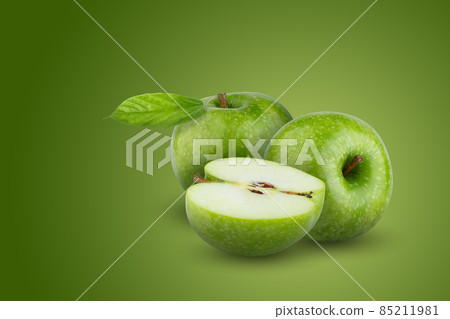 Fresh green apple isolated on green background. Fresh green apple isolated on green background. 85211981