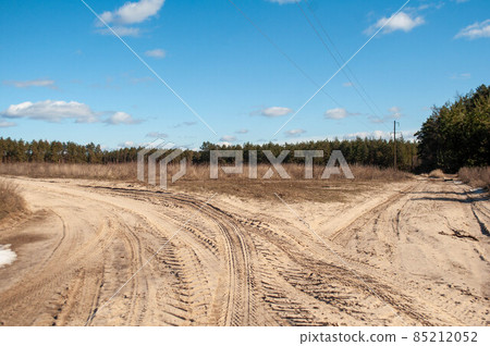 The road in the forest: there is a rough sandy road. . The road in the forest: there is a rough sandy road. . 85212052