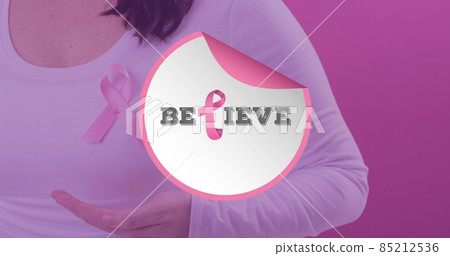 Composition of woman with breast cancer awareness ribbon and believe text against pink background 85212536