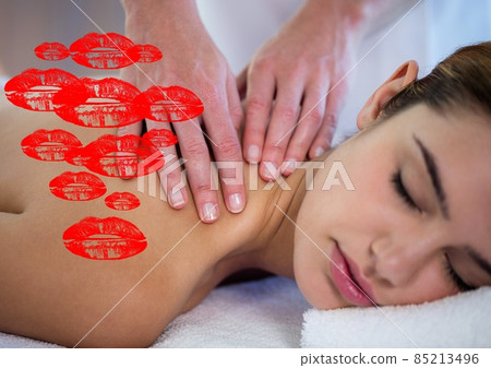 Multiple red lipstick stains icons against woman receiving a massage 85213496