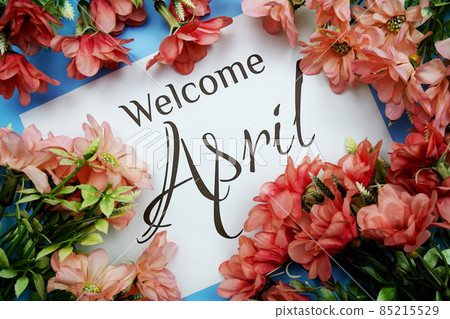 Welcome April text with Pink Flower frame on blue background Welcome April text with Pink Flower frame on blue background 85215529