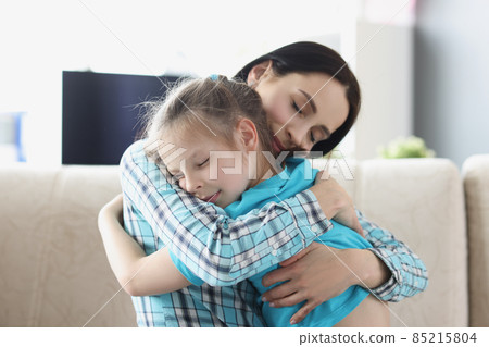 Mother and daughter hugging, smiling and receive dose of love 85215804