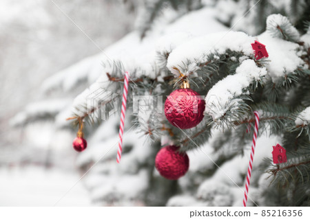Christmas and New years Holiday web banner background. Template with Xmas balls, snow on fir tree and high lights. Christmas and New years Holiday web banner background. Template with Xmas balls, snow on fir tree and high lights. 85216356