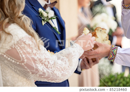 Ukrainian tradition at the wedding to break bread, brides stand with bread in their hands. 85218460