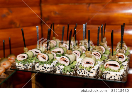 Snacks with sausage, cheese, lard and various sauces at a Ukrainian wedding. Snacks with sausage, cheese, lard and various sauces at a Ukrainian wedding. 85218480