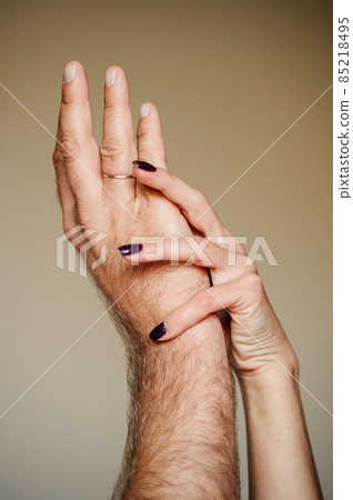 gentle touches of the hands of a man and a woman. gentle touches of the hands of a man and a woman. 85218495