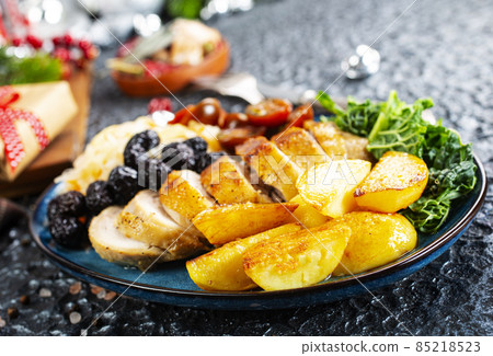 baked chicken breast with potatoes and olives on xmas background 85218523