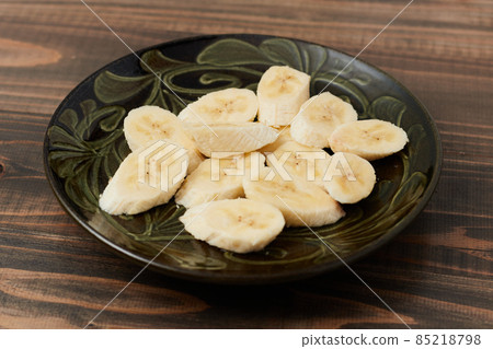 Ripe sweet cut banana served on a plate Ripe sweet cut banana served on a plate 85218798