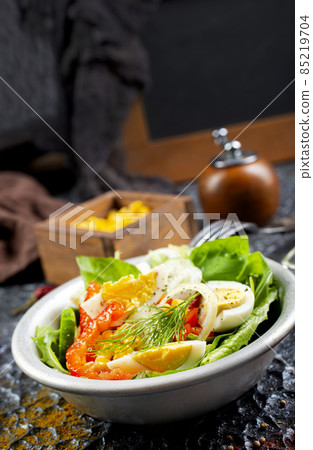 Salad with boiled egg, pepper, arugula and corn Salad with boiled egg, pepper, arugula and corn 85219704