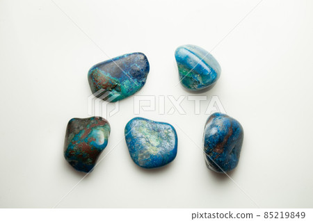 Blue shattuckite cabochon on the white background 85219849