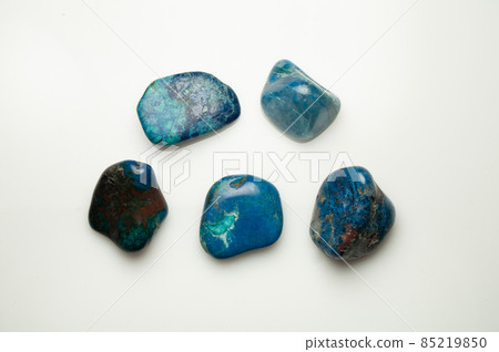 Blue shattuckite cabochon on the white background 85219850