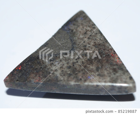 Natural boulder opal on the white background 85219887