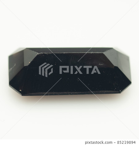 Natural black quartz morion on the white background 85219894