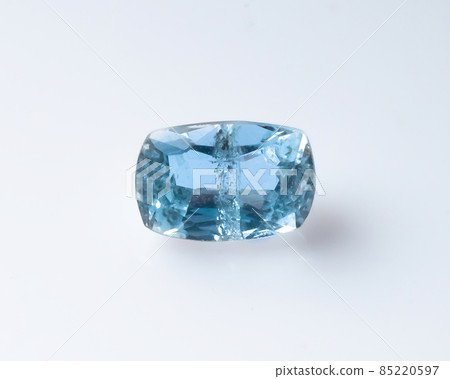 Natural faceted blue aquamarine on the white background 85220597