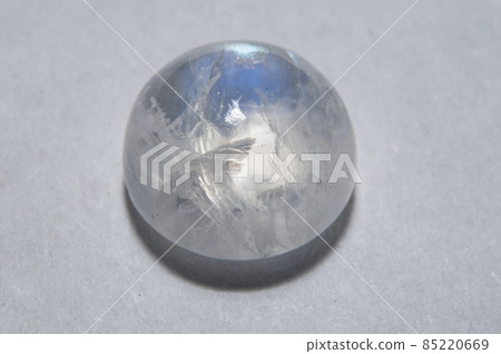 Natural white blue adular moonstone on the white background 85220669